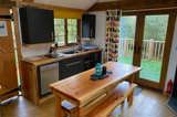 Cuckoo's Nest Tree House kitchen and dining area at Florence Springs Glamping Village - luxury glamping near Tenby, Pembrokeshire, South West Wales